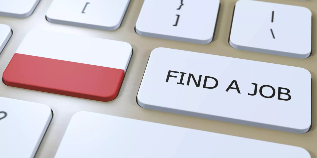 Keyboard with the Polish flag and the words find a job