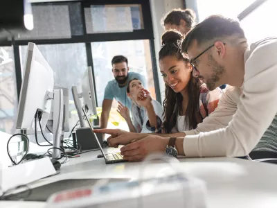 Young people working in front of computer