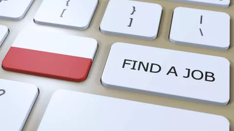 Keyboard with the Polish flag and the words find a job